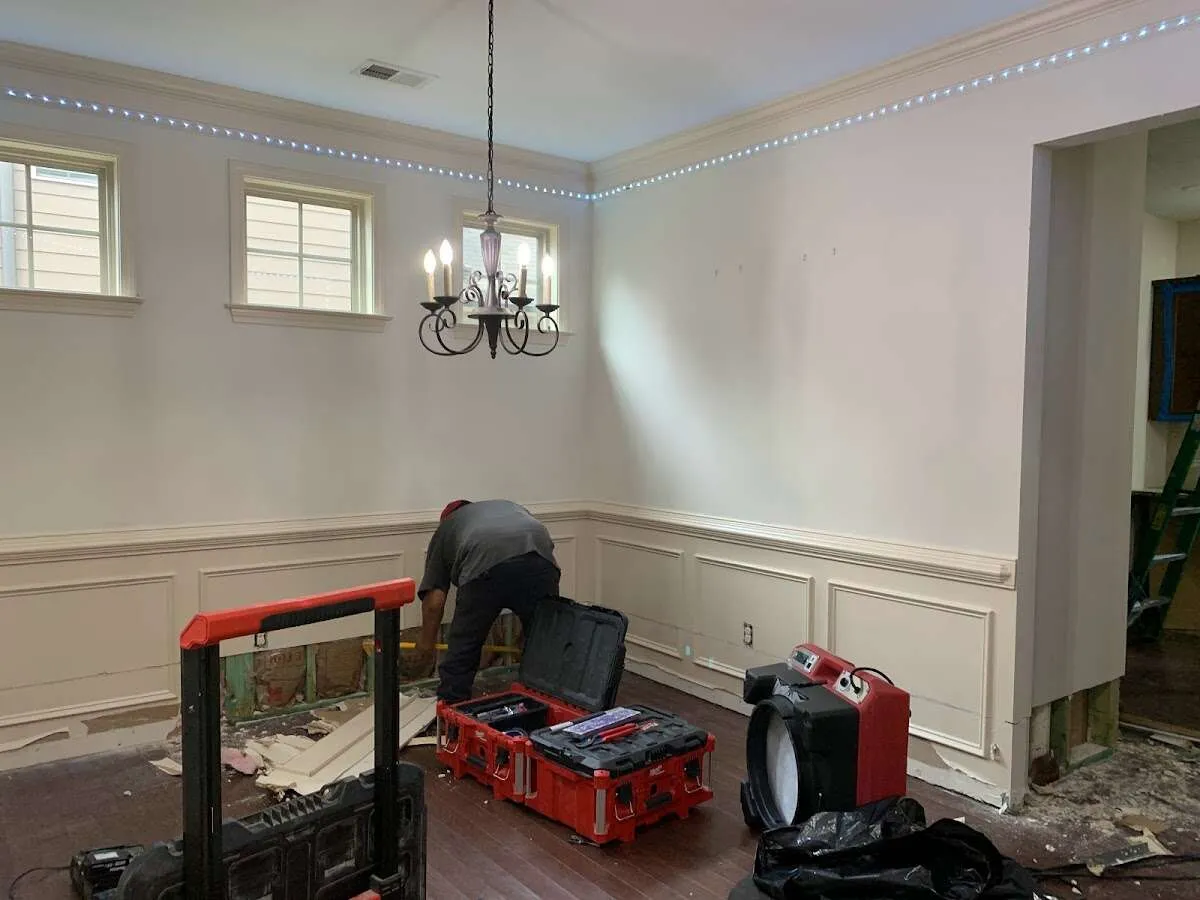 Restoration technician with professional equipment in Fort Lee